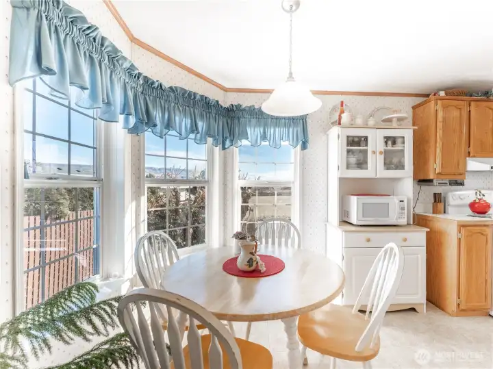 Additional dining nook off kitchen offering flexible everyday dining space