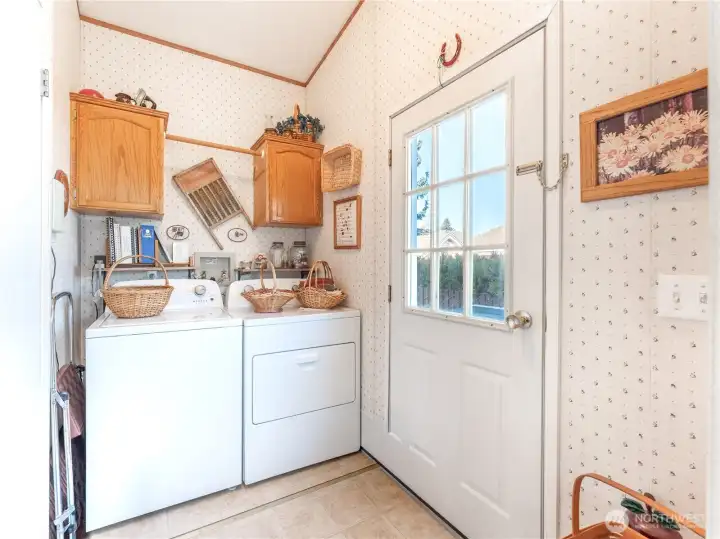 Laundry room off dining nook with convenient exterior door access