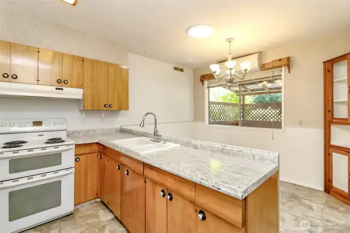 The kitchen offers a functional and welcoming space.