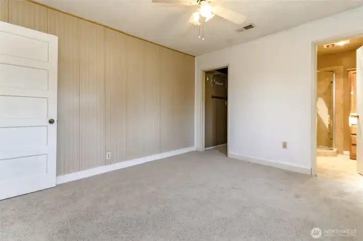 The primary bedroom includes its own bathroom providing a private and comfortable retreat.