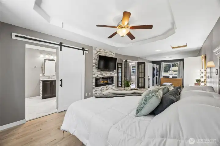 Primary suite with infrared fireplace and bath off bedroom