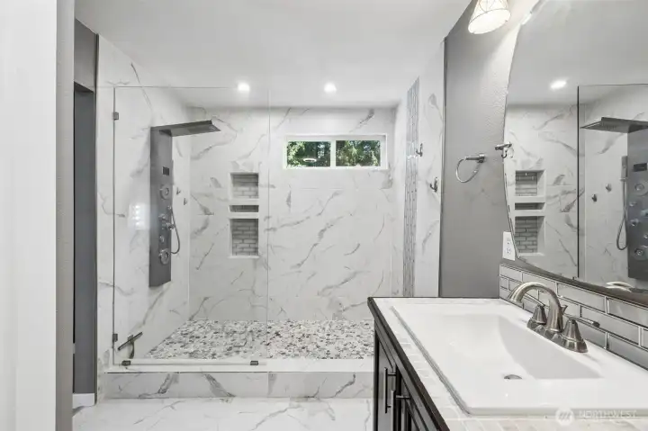 Walk in tile bathroom with upgraded shower tower
