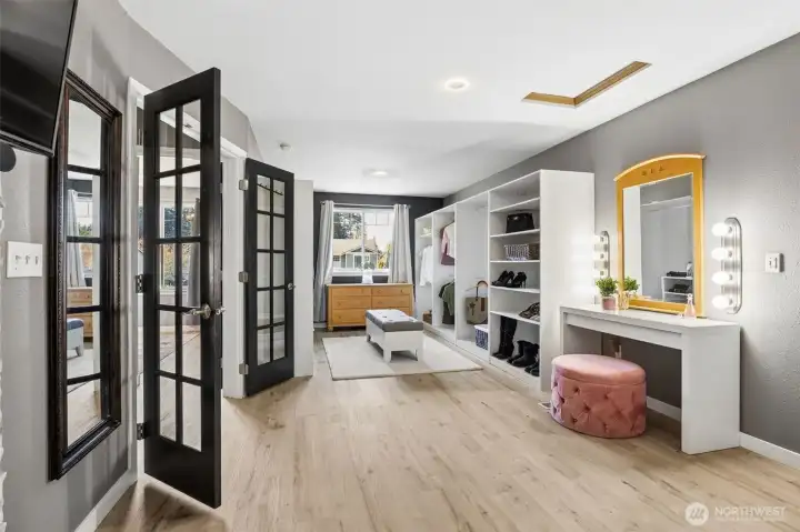 French doors lead to hallway and 2nd upper bedroom