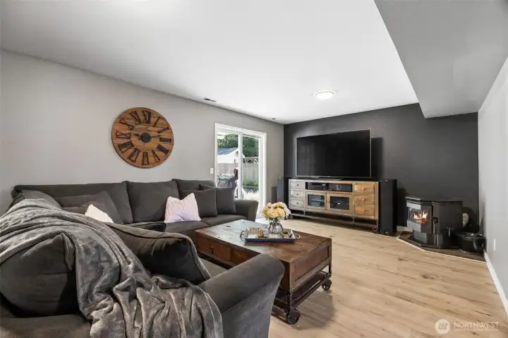 Lower living room with slider to patio and back yard