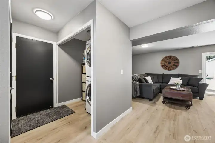 Utility room with under stair pantry storage and door to 3 car extra deep garage