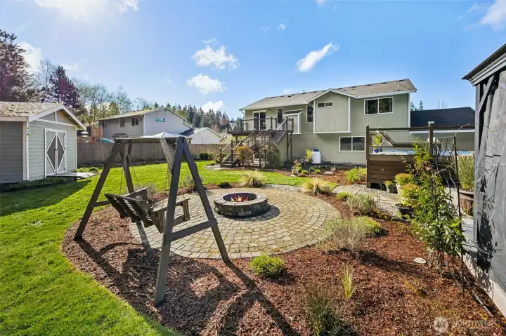 Paver stone firepit area with swing