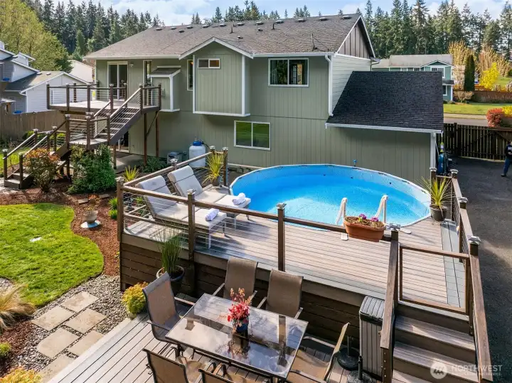 Above ground pool with Trex decking and safety fenced