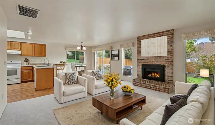 Secondary living space with fireplace insert just off of the kitchen
