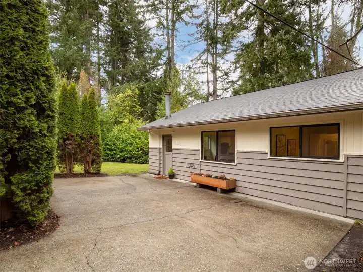 Welcome to home #2.  The cottage is located on the East side of the lot with open floor plan and 1 bedroom and 1 bathroom.    This home is freshly painted inside and out, with new LVP, carpet new kitchen and electrical panel.