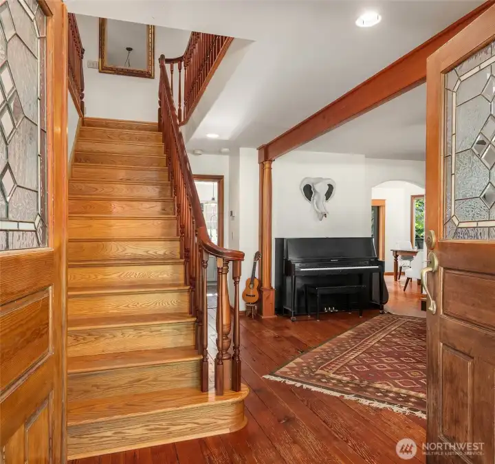 Entrance to this beautiful home leads you into the living room, family room or beckons up the gorgeous stair directly to the bedrooms.