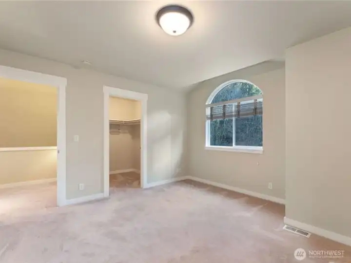 Another shot of the upstairs bedroom with the walk-in closet. Photo depicts the room without furniture; seller furnishings are currently in the home. Another shot of the upstairs bedroom with the walk-in closet. Photo depicts the room without furniture; seller furnishings are currently in the home.
