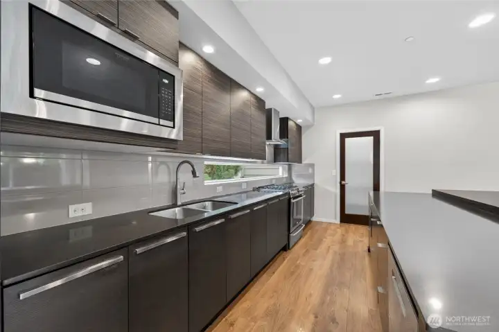 Abundant cabinetry and a walk-in pantry provides excellent storage.