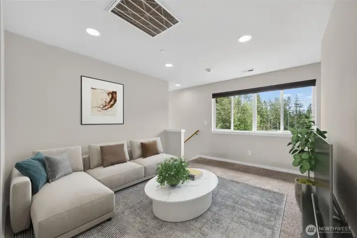 Virtually staged. Upper-level loft creates valuable bonus living space.
