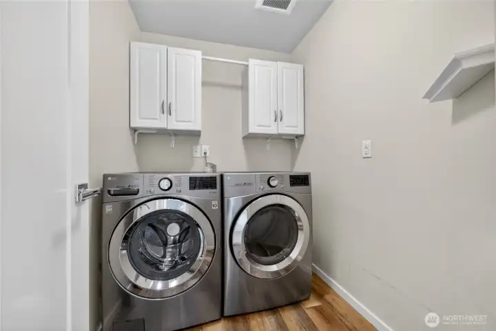 Dedicated laundry room with convenient built-ins.