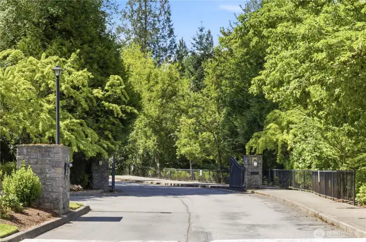 A very serene drive home, cross a beautiful bridge and enjoy the meandering road that winds you up to the gated entry seen towards to top of this photo. It's nice to be set back from the main roads, surrounded by nature yet close enough to get to the grocer in five minutes.