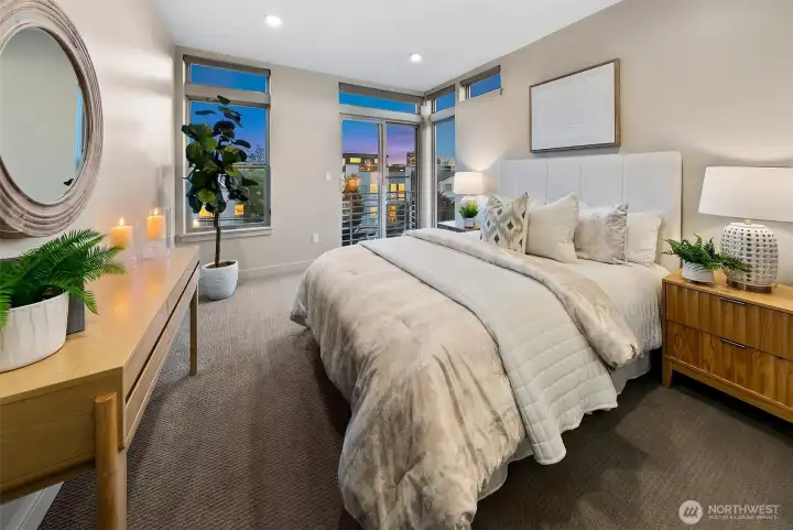 over sized primary wrapped with window and private terrace