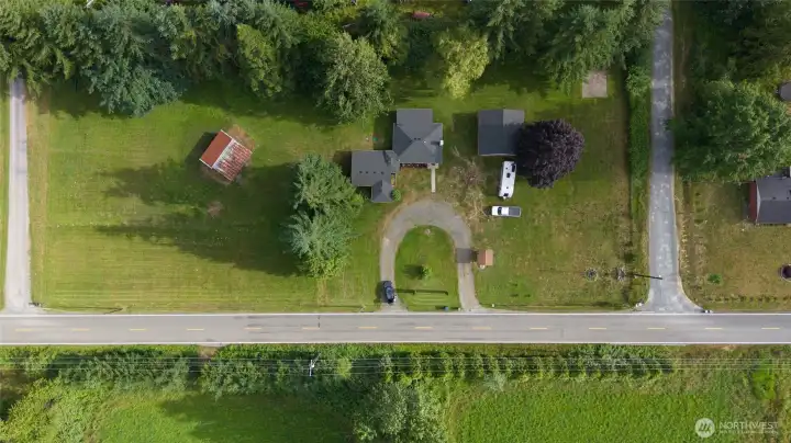 This aerial photo shows the property frontage with the house, oversized garage and horse stall. Lots of space in the pasture. This aerial photo shows the property frontage with the house, oversized garage and horse stall. Lots of space in the pasture.