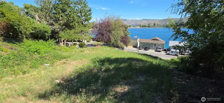 Welcome to 410 Manson Blvd. A Lake Chelan view lot with no HOA right across the street from Manson Bay!