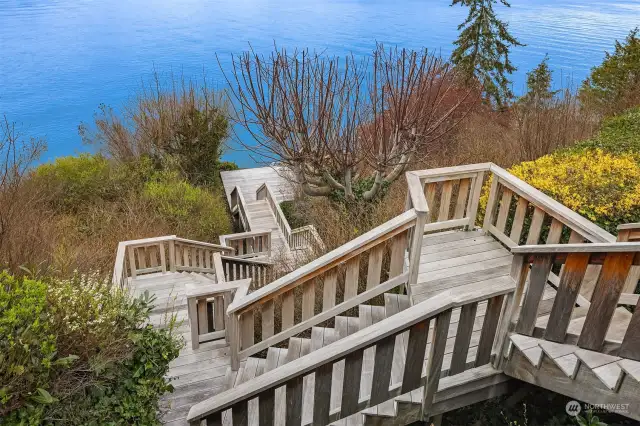 Staircase leads to a private deck & firepit