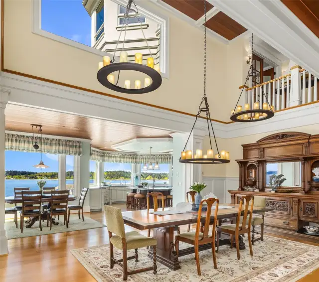 Formal dining room showcasing a 2-story open ceiling