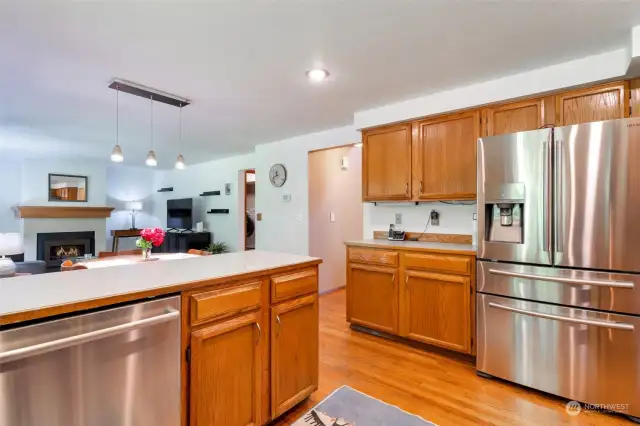 Bright kitchen with high end stainless appliances.