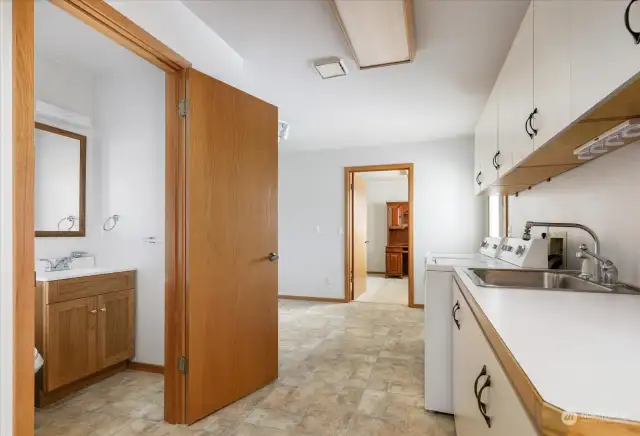 Powder room off of laundry room - looking into den