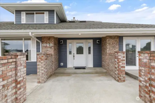 Entry way to front door - patios on either side.