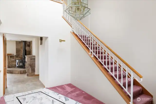 Formal entry looking into family Room and up stairs