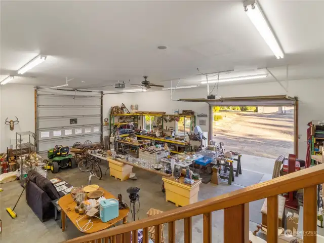 Lighted workshop with woodstove, laundry hookups and water heater.