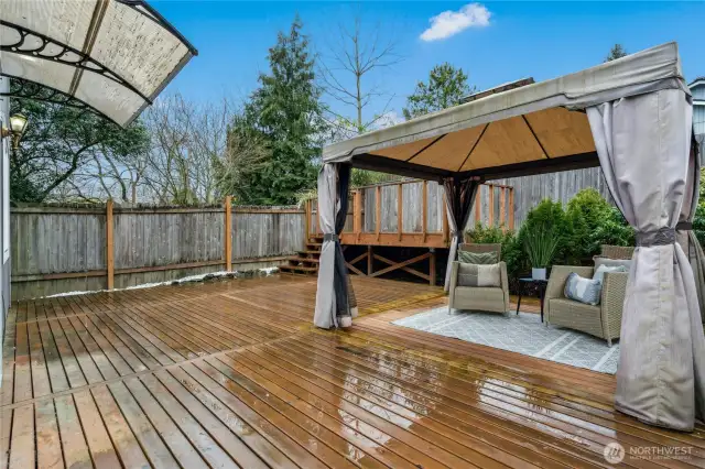 Fully fenced yard with newer deck and gazebo with sitting area - perfect for sitting outside and relaxing!