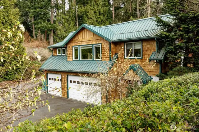 Three car garage with wine cellar; studio/office space above