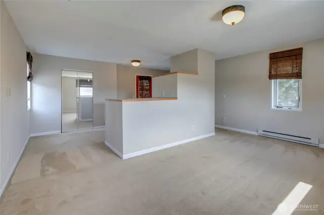 Upper bedroom with walk-in closet and balcony.