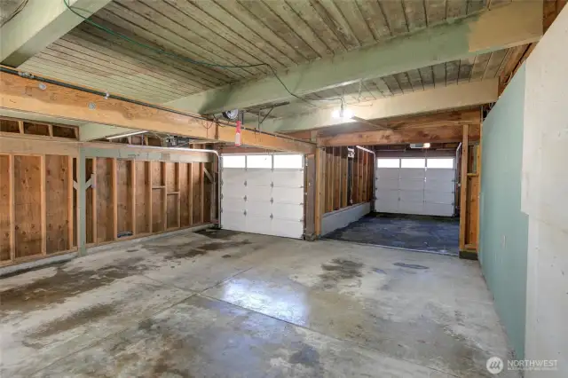 Large garage can accommodate 3 cars.