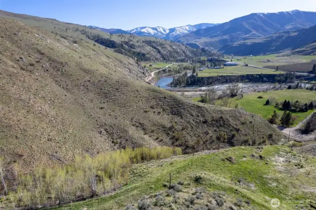Landscape with trees, creek and views.