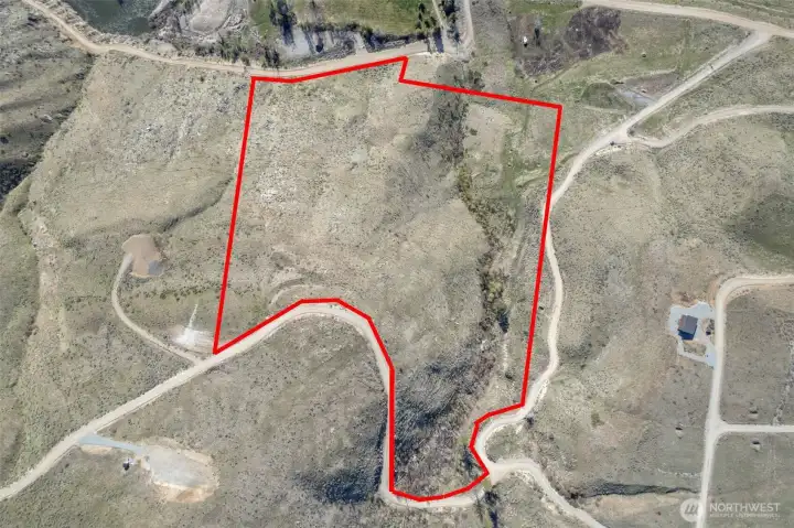 21.5 Acres enjoys easy access off of Cowboy Road and 2 distinct homesites on this elevated acreage.  One homesite is tucked into remarkable green Spring-fed creek with Aspens and other trees, shrubs and flowering trees. Original Homestead location found here. Recreate a new home or Cabin where the homesteaders established a highly desirable location. Or go to the top of this property for stellar view building site.