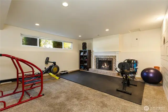 Rec room  woodwith a second burning fireplace.