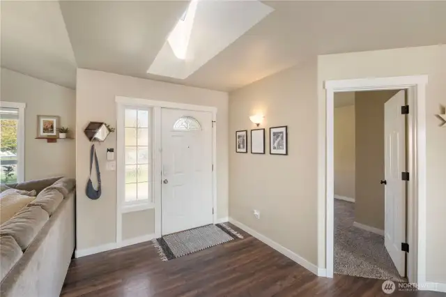 To the left of entry is one of three bedrooms