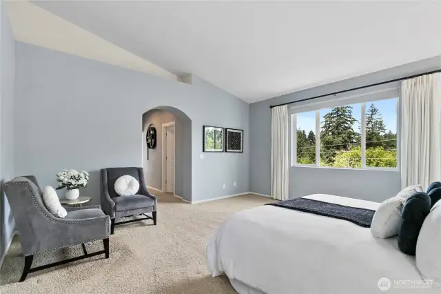 Greenbelt views out primary bedroom