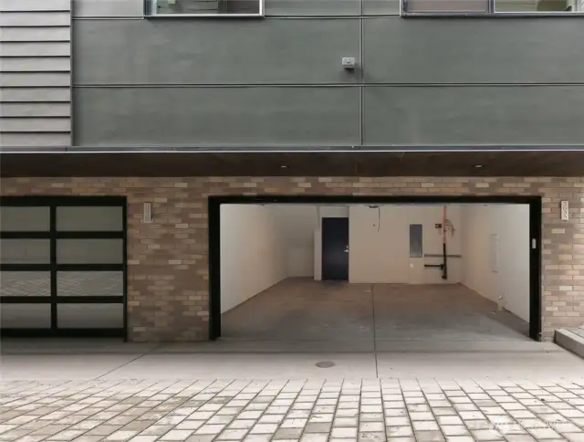 2 car fully finished garage, finished floor, can lights, & textured.
