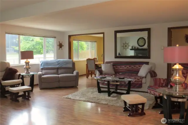 WELCOME INTO YOUR NEW LIVING ROOM WITH VIEWS OF THE 5TH FAIRWAY.  HOME HAS WOOD LIKE FLOORING THROUGH OUT!