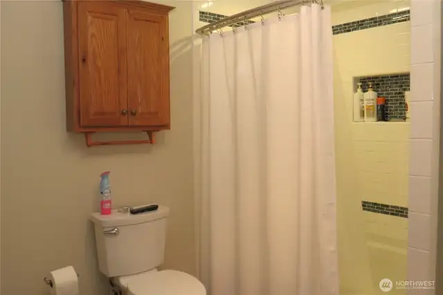 THIS FULL BATH HAS TILED BACK SPLASH IN THE TUB/SHOWER COMBINATION!