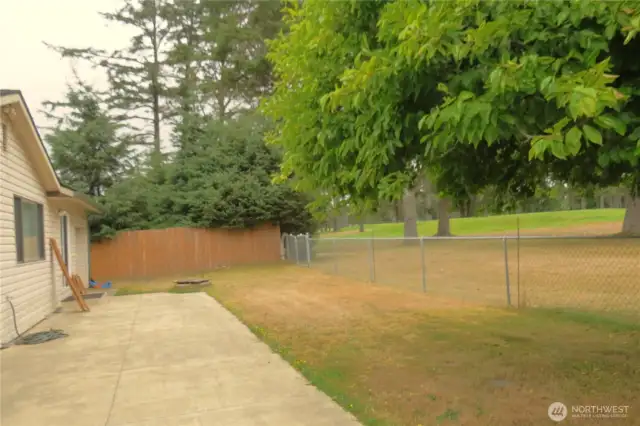 NORTH VIEW OF THE PATIO! DRIVE YOUR GOLF CART THROUGH THE GATE AND JOIN YOUR FRIENDS IN A ROUND OF GOLF!