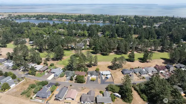 VIEW EAST OVER THE HOME SHOWING THE FAIRWAY THEN ON TO DUCK LAKE AND THE BAY IN THE BACK GROUND!