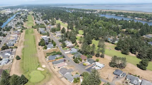 AERIAL OF THE OTHER GREENS AND FAIRWAYS TOWARD DOWNTOWN OCEAN SHORES! TO THE LEFT IS THE GRAND CANAL! TO THE RIGHT IS DUCK LAKE AND THEN THE BAY!