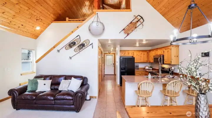 Open floor plan living area leads to the loft upstairs.