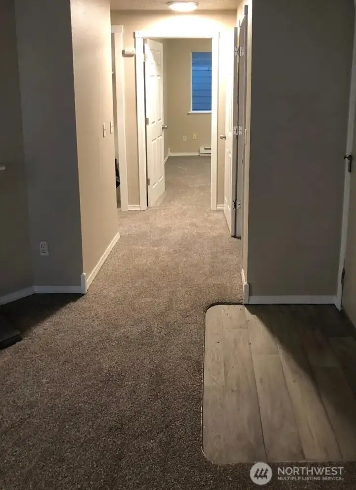 Unit 3 -Entry, wall to wall carpet, laminate flooring fireplace, washer and dryer and 2 bed 1 baths.