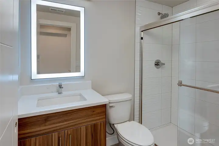 Glass Paned Bathroom And Back Lit Mirror