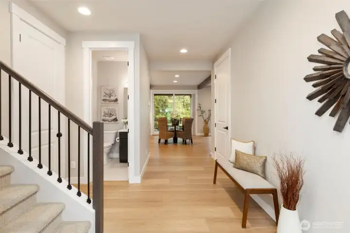 Light-filled entry with clean lines and a warm, inviting flow.  Laminate Hardwood on the main, loft, and 4th bedroom.