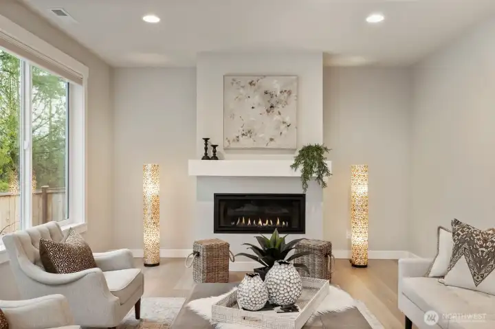 Spacious great room with abundant natural light and 42" Cosmo Linear Gas Fireplace.