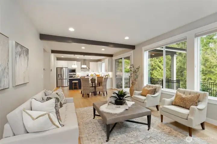 Seamless connection between living, dining, back outdoor space, and kitchen spaces.